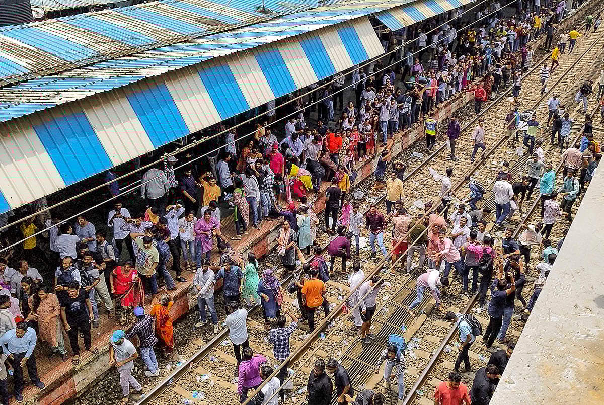 PTI : Angry people block railway tracks at Badlapur railway station in protest against the alleged sexual abuse of two girls at a school, in Thane district, Tuesday, Aug. 20, 2024